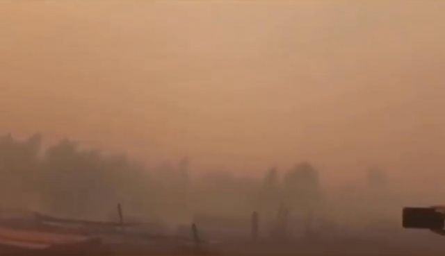 Лесной пожар перекинулся на якутскую деревню Бясь-Кюель - фото 5