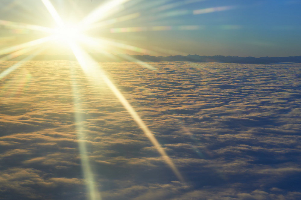 Glowing Sun on Clear Blue Sky.